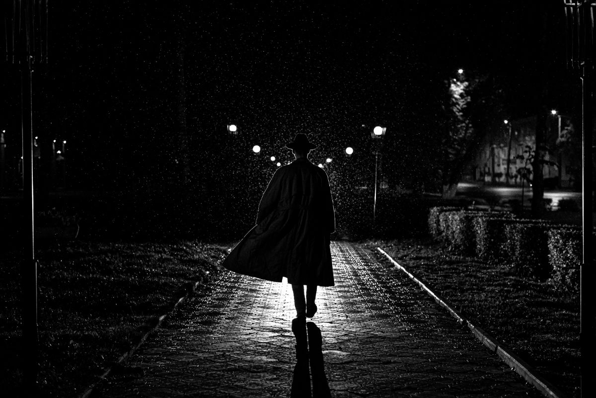 A mysterious man walks on the street,