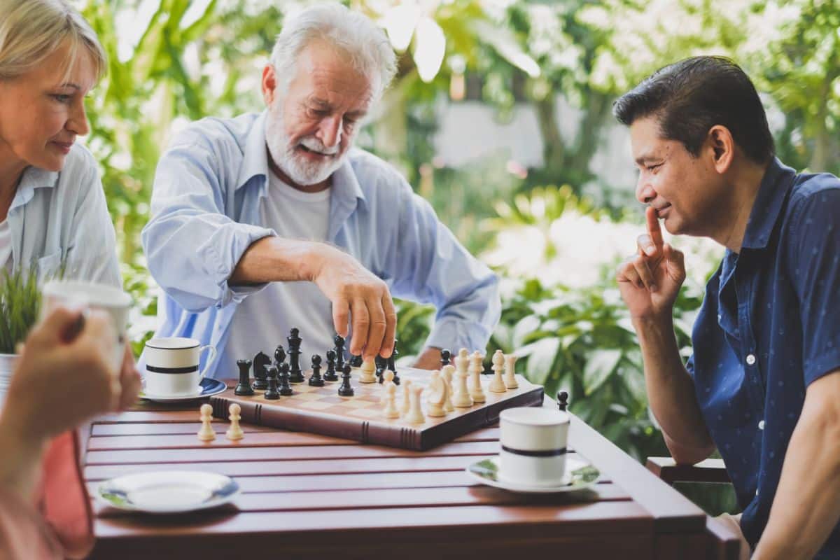 Two elder men are playing chess.