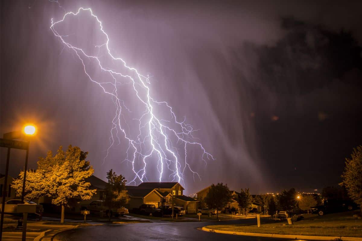 A lightning strike over a house.