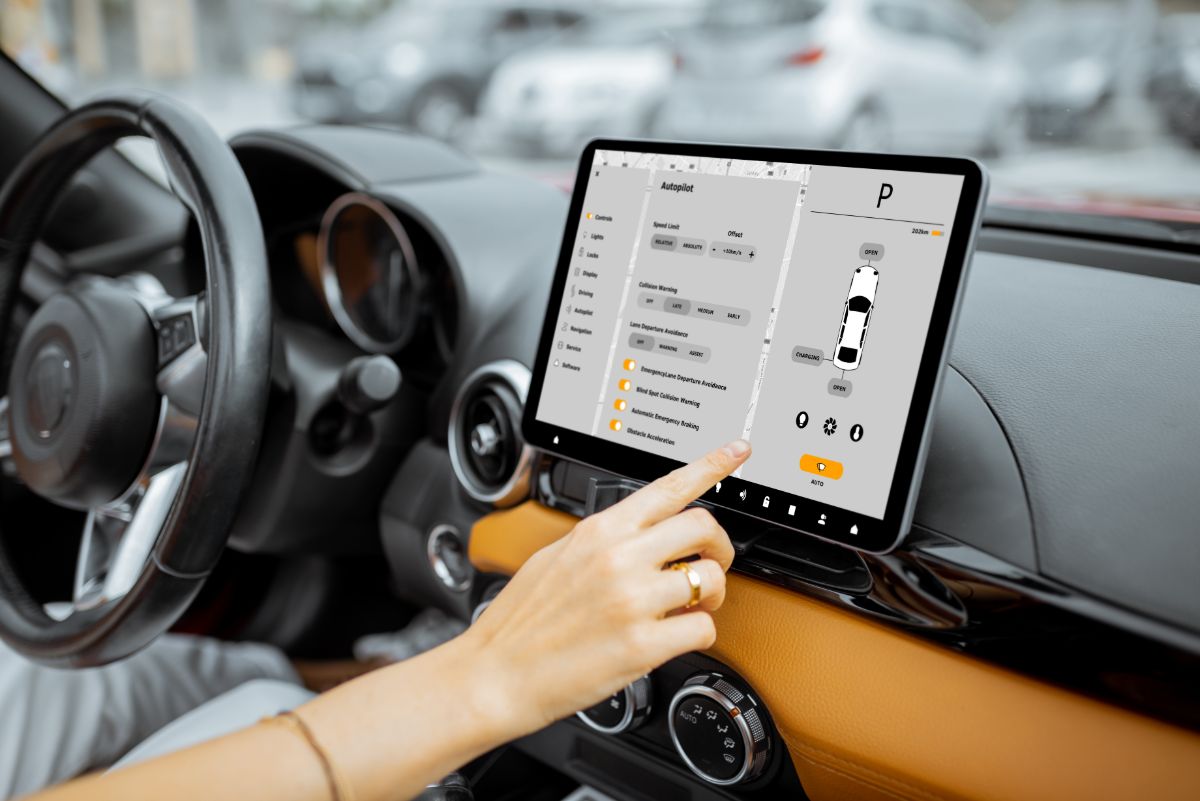 A car dashboard with a big screen.