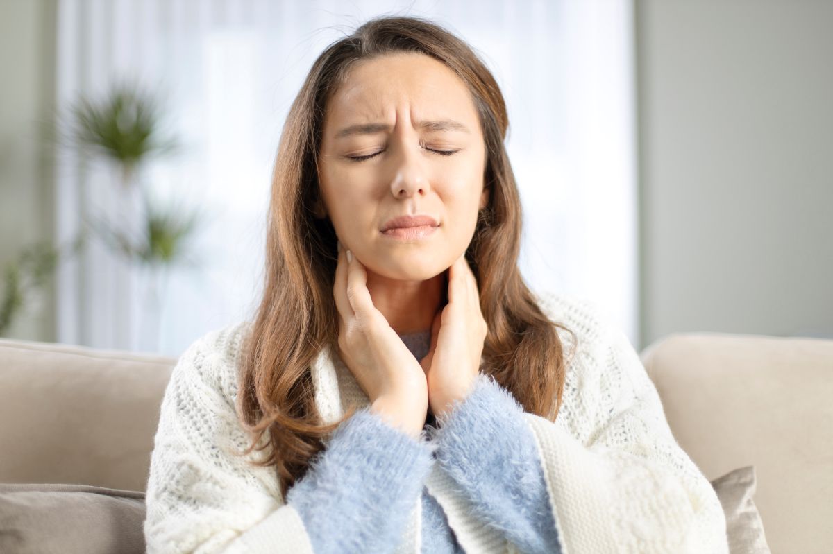 A young woman with a sore throat.